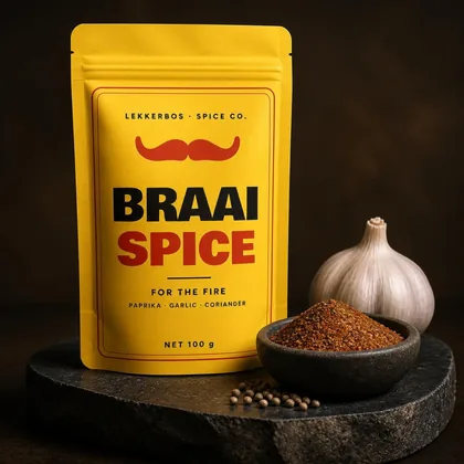 Lemon-yellow Braai Spice pouch with a dish of paprika blend and a garlic bulb